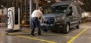 A photo showing the exterior of the Ford E-Transit from a front three quarters angle.