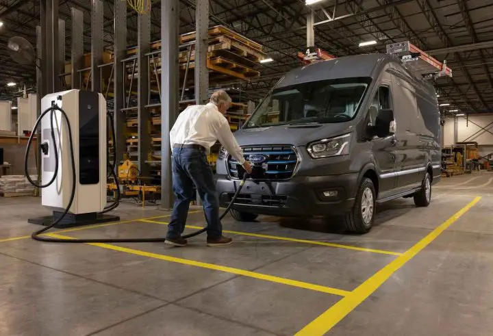A photo showing the exterior of the Ford E-Transit from a front three quarters angle.