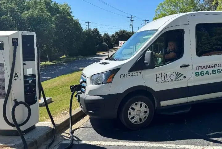 A photo showing the exterior of a Ford E-Transit from a front three quarters angle.