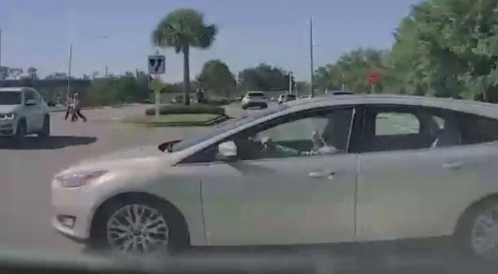 Video still of the Ford Focus that blew through an intersection, almost hitting the cammer in the process.