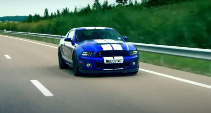 Video still of the Ford Mustang Shelby GT500 being driven by Jeremy Clarkson, racing against a train in a classic Top Gear episode. 