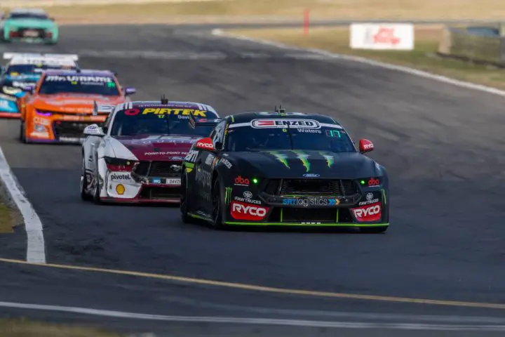Photo of the race at New Zealand with Supercars Ford driver Cam Waters pictured in front. Ford Mustang race cars accounted for almost every podium position throughout the weekend.
