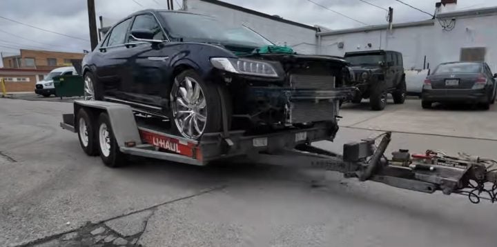 Video still of the V-10 swapped Lincoln Continental on its way to the dyno, being towed in on a trailer. It produced close to 500 wheel horsepower.