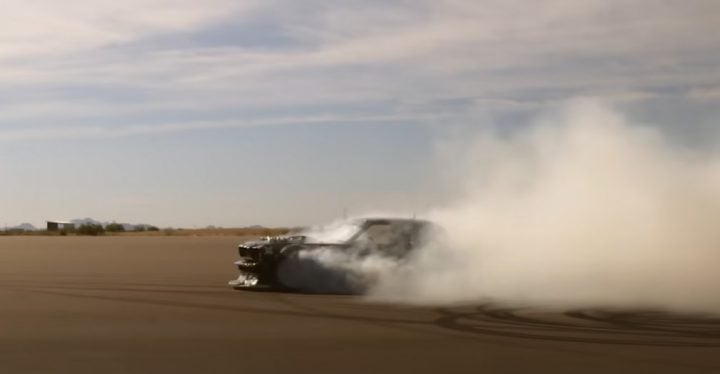 Video still of the 1965 Ford Mustang Hoonicorn on track. This build was the result of a collaboration between RTR Vehicles and Ken Block. 