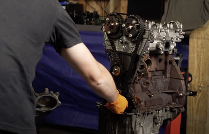 A photo showing a teardown of a damaged 1.0L Ford EcoBoost engine.