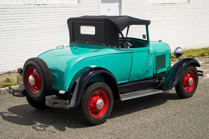 A photo showing the exterior of a 1928 Ford Model A from a rear three quarters angle.