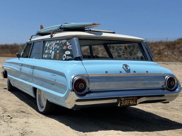 A photo showing the exterior of a 1964 Ford Galaxie Country Sedan from a rear three quarters angle.