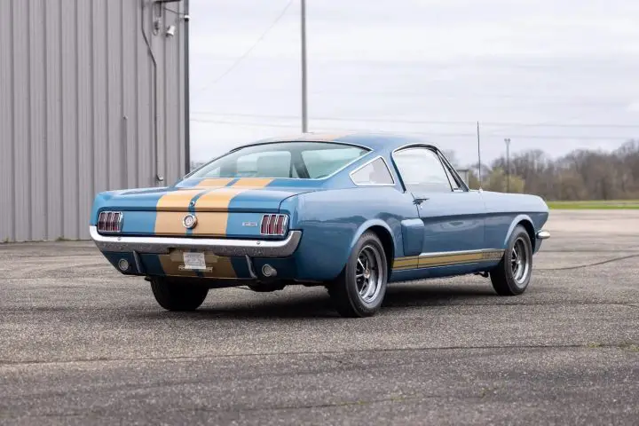 A photo showing the exterior of a 1966 Ford Mustang Shelby GT350H from a rear three quarters angle.