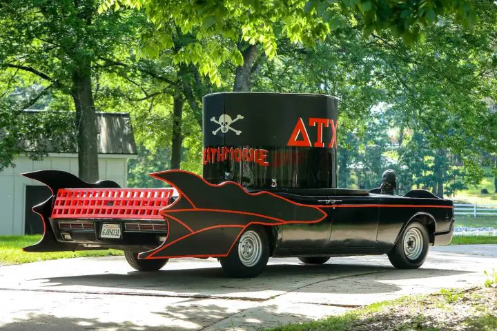 A photo showing a 1966 Lincoln Continental 'Deathmobile' Animal House recreation from a rear three quarters angle.