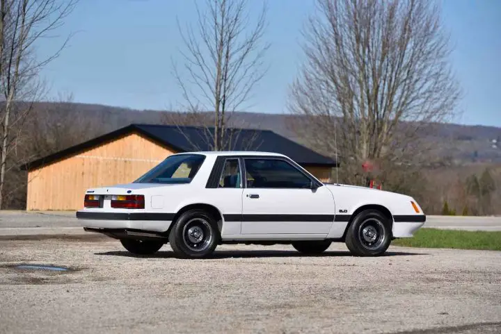 A photo showing the exterior of a 1986 Ford Mustang LX SSP from a rear three quarters angle.