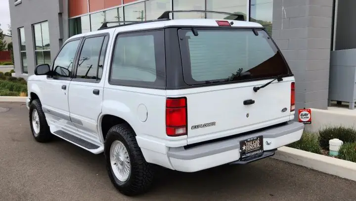 A photo showing the exterior of a 1993 Ford Explorer Limited from a rear three quarters angle.