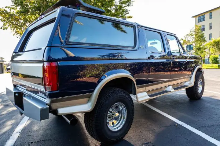 A photo showing the exterior of a 1995 Ford C-30 XLT Centurion from a rear three quarters angle.