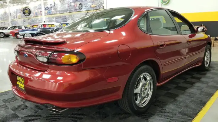 A photo showing the exterior of a 1996 Ford Taurus SHO from a rear three quarters angle.