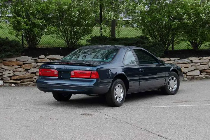A photo showing the exterior of a 1997 Ford Thunderbird LX from a rear three quarters perspective.