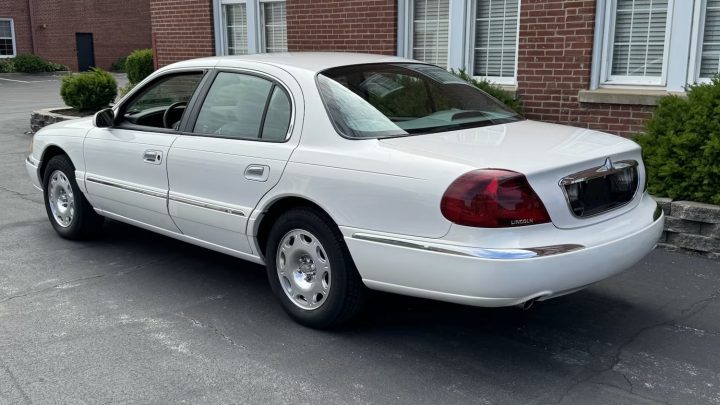 A photo showing the exterior of a 2002 Lincoln Continental from a rear three quarters angle.