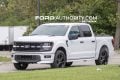2026 Ford F-150 Lobo front three quarters view on public road.