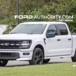 2026 Ford F-150 Lobo front three quarters view on public road.
