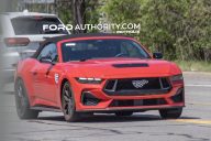 2026 Ford Mustang GT convertible, front three quarters view on public road.