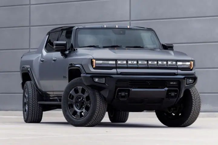 A photo showing the exterior of the 2026 GMC Hummer EV pickup from a front three quarters angle.