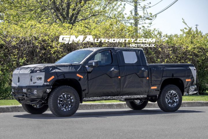 Photo of the 2027 Silverado ZR2 prototype, shown from a front three-quarters angle. This model will rival the Ford F-150 Raptor when it debuts. 