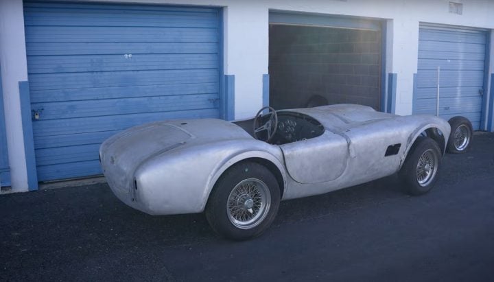 A photo showing the exterior of a 289 Shelby Cobra from a rear three quarters angle.