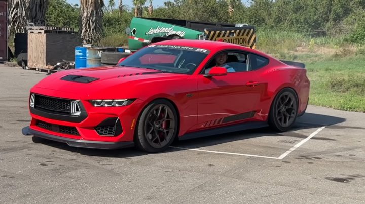 Video still of Cleetus McFarland's Ford Mustang RTR parked before he slaps a brick and wrecks it. 