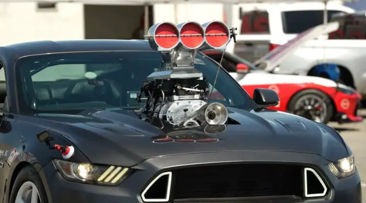 Video still of the supercharged Ford Mustang built by Emelia Hartford heading to the dragstrip. It gave its best performance yet after years of work.