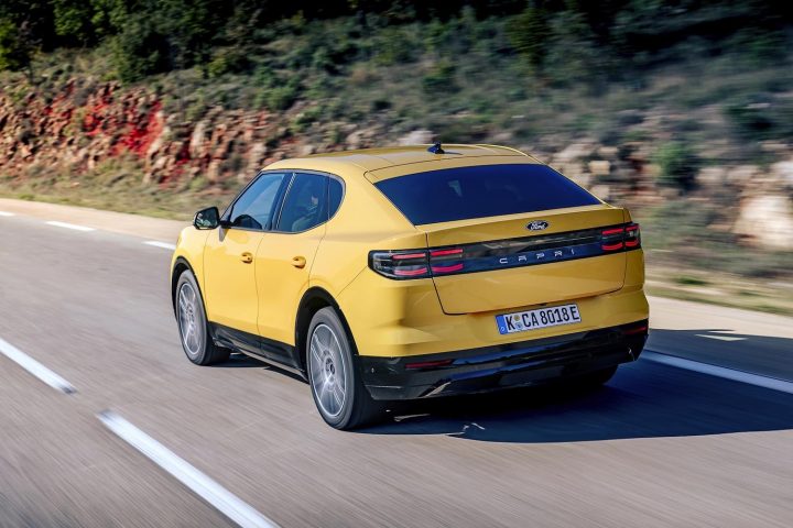A photo showing the exterior of the Ford Capri EV from a rear three quarters angle.