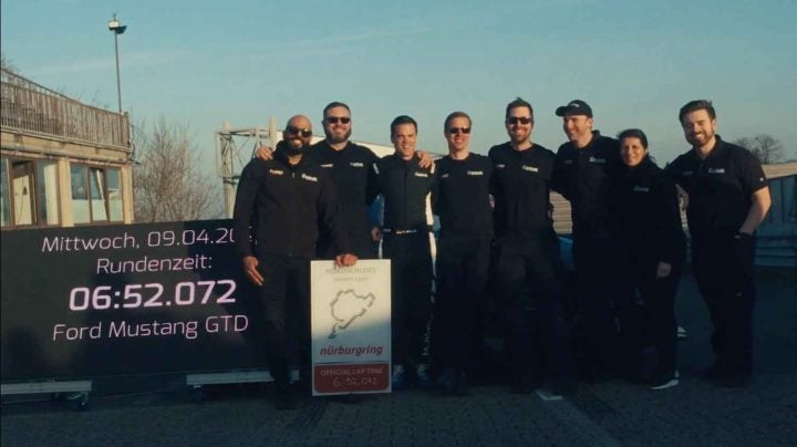 A photo showing the Ford Performance team at the Nurburgring with the Ford Mustang GTD.