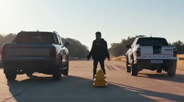 Video still of the Ford Ranger Raptor and the BYD Shark 6 at the start of a drag race. Surprisingly, the Ranger Raptor didn't hold up all that well. 