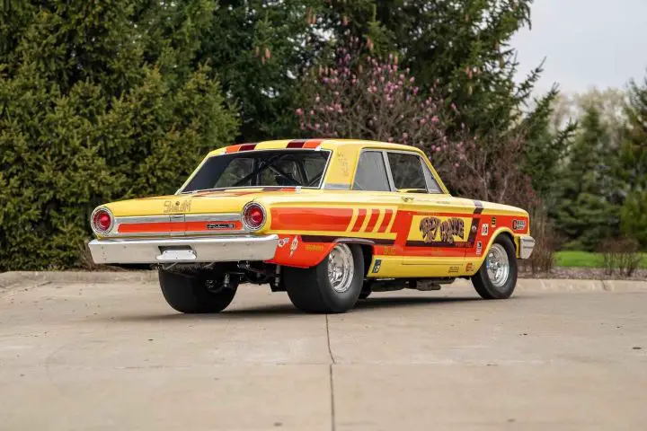 A photo showing the exterior of the 'Nazy Crate' 1964 Ford Thunderbolt from a rear three quarters angle.