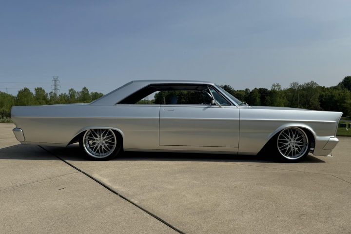 A side view of the 1965 Ford Galaxie for sale. This fastback was heavily modded by its current owner, who fit a 5.0L Coyote V8 under the hood.