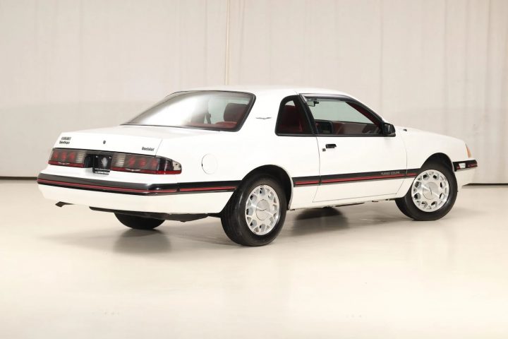 A photo showing the exterior of a 1988 Ford Thunderbird Turbo Coupe from a rear three quarters angle.