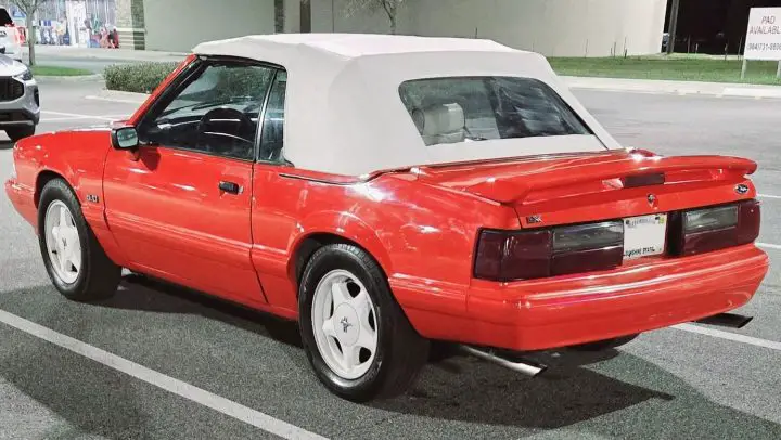 A photo showing the exterior of a 1992 Ford Mustang Summer Edition from a rear three quarters angle.