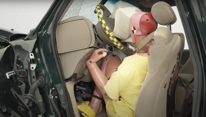A photo showing a crash dummy inside of a 2001 Ford F-150.