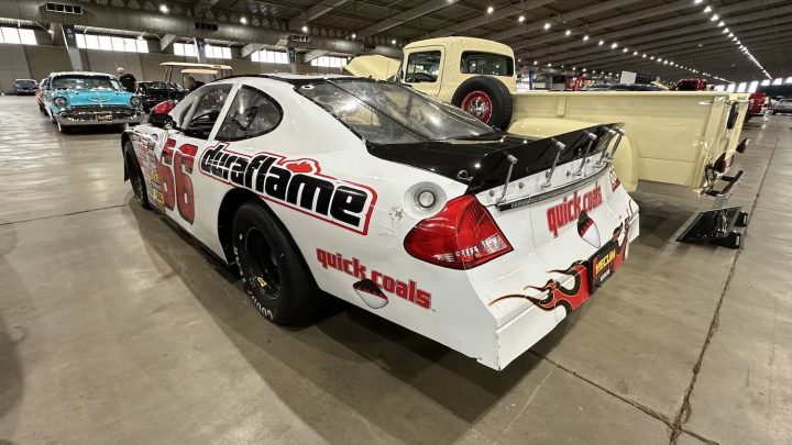 A photo showing the exterior of a 2005 Ford Taurus NASCAR racer from a rear three quarters angle.