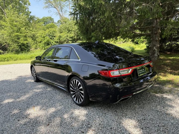 A photos showing the exterior of a 2019 Lincoln Continental Coach Door Edition from a rear three quarters angle.
