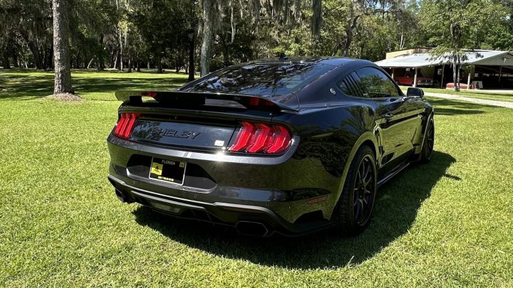 A photo showing the exterior of a 2022 Ford Mustang Shelby Super Snake from a rear three quarters angle.