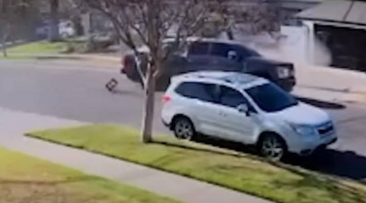 Video still of the Ford Super Duty that fell off a tow truck onto another vehicle, totaling it. 