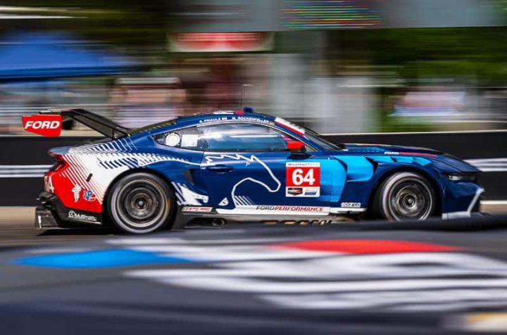 Photo showing the No. 64 Ford Mustang GT3 on track, seen from a side view at speed. The race car went on to win the GTD Pro class. 