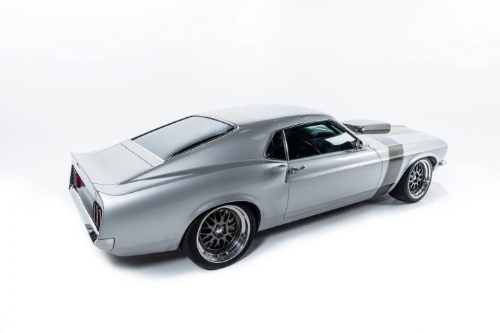 A photo showing the exterior of a 1969 Ford Mustang from a rear three quarters angle.
