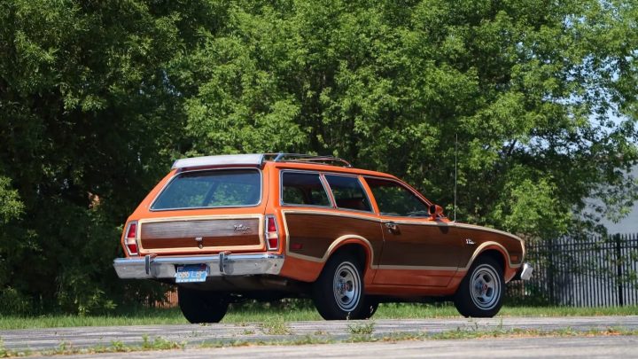 A photo showing the exterior of a 1974 Ford Pinto Squire Wagon from a rear three quarters angle.