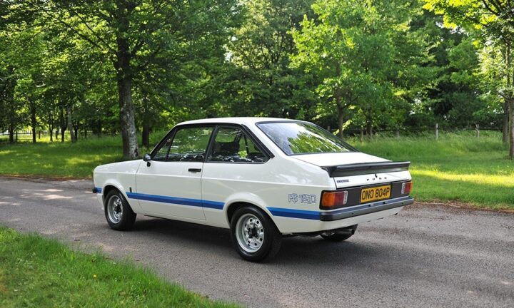 A photo showing the exterior of a 1976 Ford Escort MK II RS 1800 press car from a rear three quarters angle.
