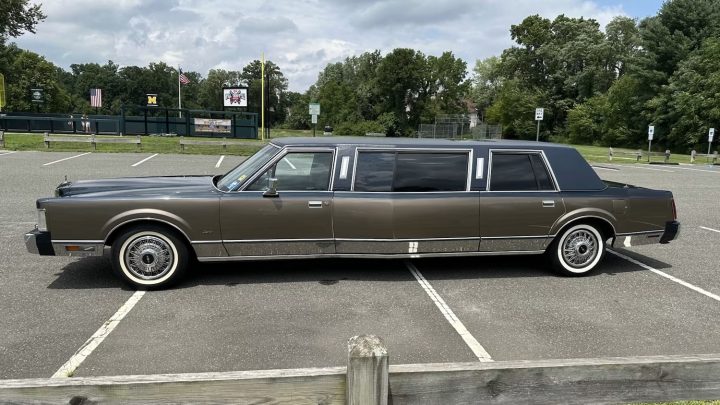 A photo showing the exterior of a 1986 Lincoln Town Car 'Wide Body' Limousine from a side angle.