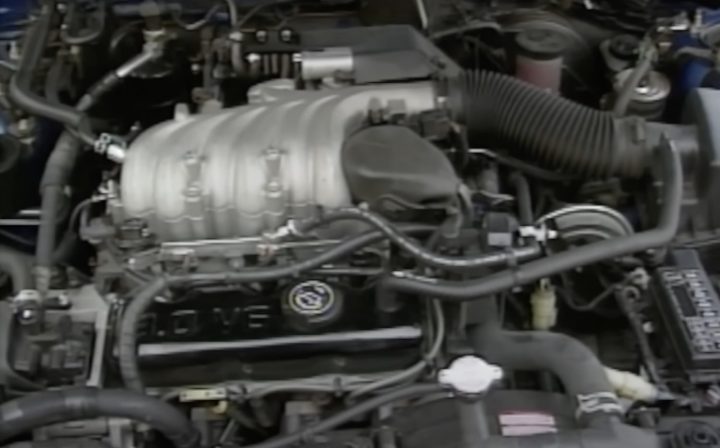 A photo showing the engine bay of a 1990 Ford Probe.