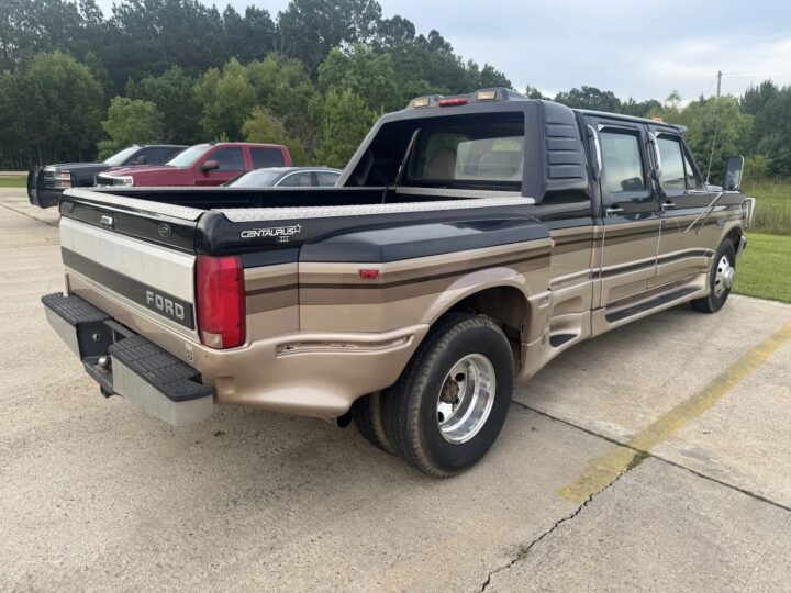 A photo showing the exterior of a 1996 Ford F-350 XLT Centaurus III from a rear three quarters angle.