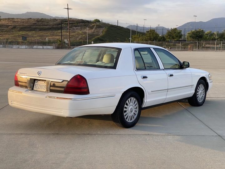 A photo showing the exterior of a 2008 Mercury Grand Marquis LS from a rear three quarters angle.