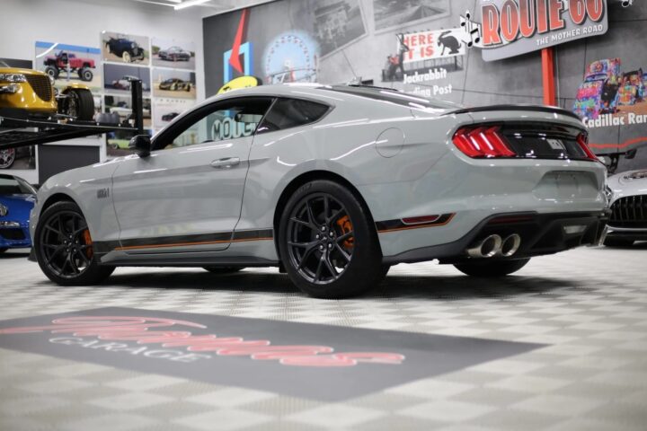A photo showing the exterior of a 2023 Ford Mustang Mach 1 from a rear three quarters angle.