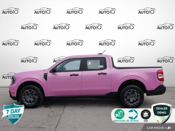 A photo showing the exterior of a pink vinyl-wrapped 2025 Ford Maverick from a side angle.