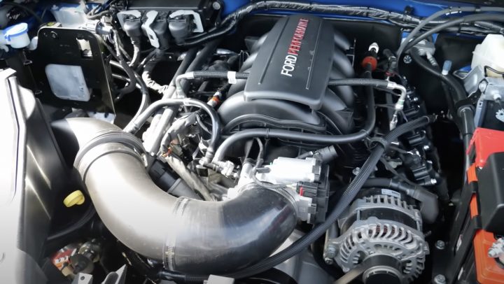 A photo showing the engine bay of a Ford Bronco Raptor with a 7.3L V8 Godzilla swap.